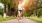 a woman running with her dog