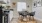 a kitchen with a table and chairs